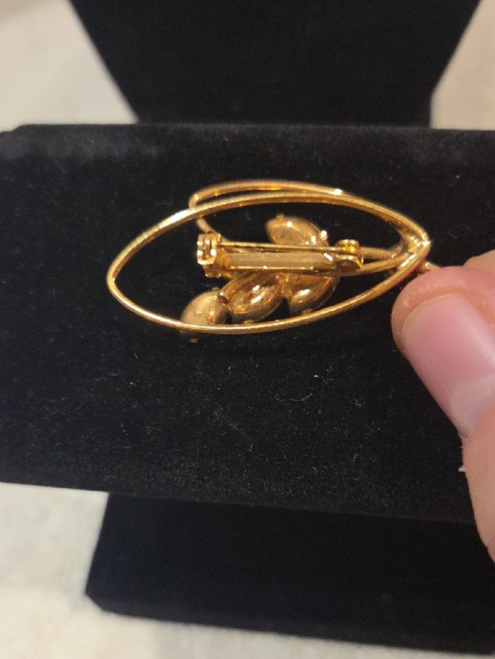 Gold-Tone Leaf Brooch with Purple Marquise Stones